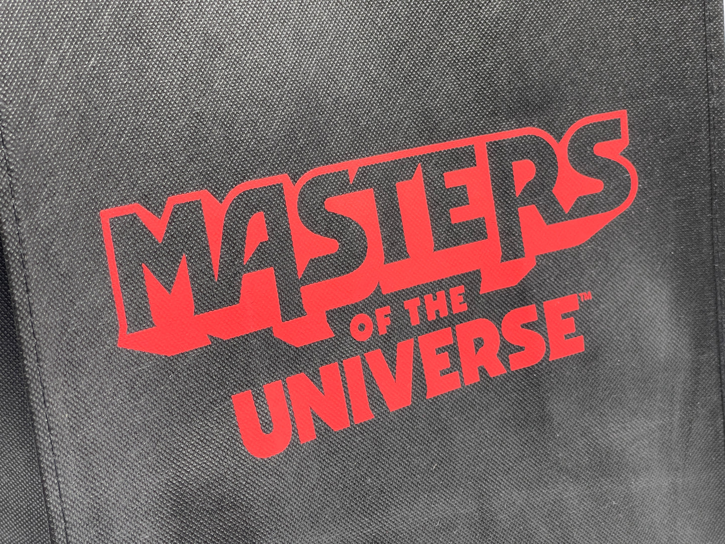 Masters of the Universe "Tragetasche, Tüte" mit MOTU Logo schwarz/rot (Mattel)